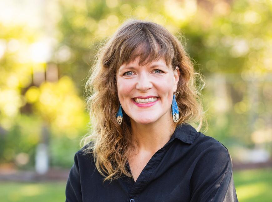 Kara Cavel poses for a professional headshot. 